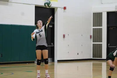 ball above volleyball player's head