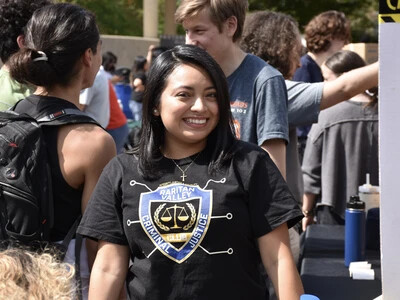RVCC student smiling for a photo at the club involvement fair.