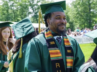 RVCC graduate smiling for a photo at comencement.