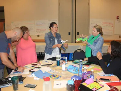 Group of science teachers working on a project