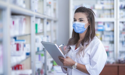 female pharmacist wearing face mask