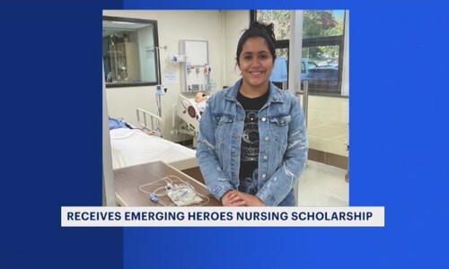 emerging heroes scholarship recipient in blue jacket