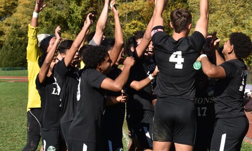 men's soccer players from back with hands in air