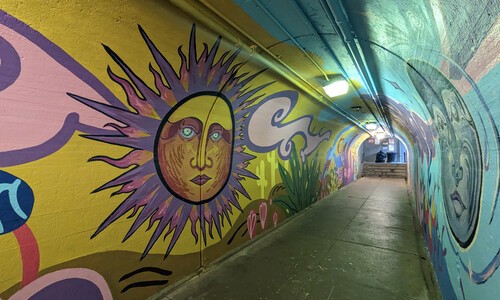 tunnel mural with giant sun