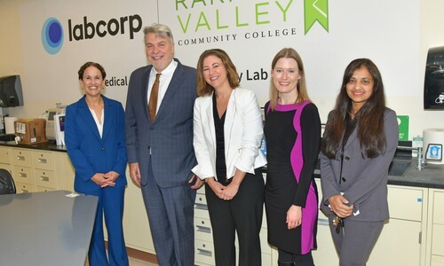 5 people in rom with labcorp and rvcc signs