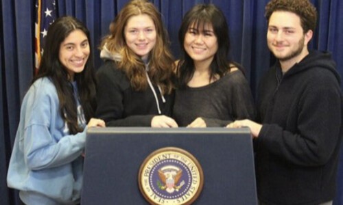 honors college students at white house podium