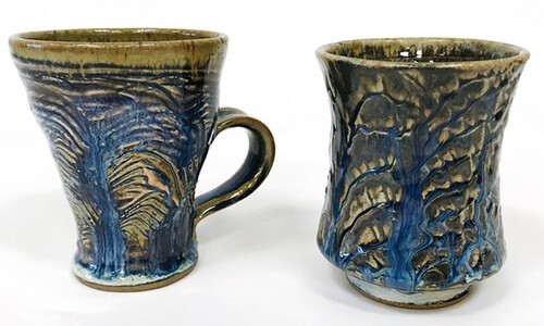 2 colorful ceramic mugs