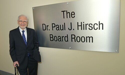 paul hirsch with sign with his name