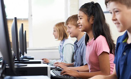 elementary students in computer lab