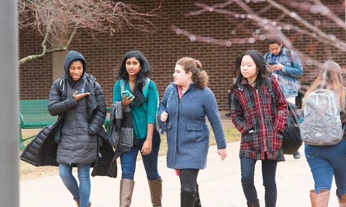 row of female students walking outside