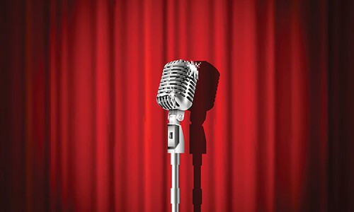 microphone in front of red curtain