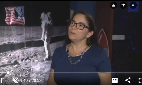 amie gallagher with moon landing photo