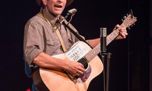 Randy Noojin as Woody Guthrie