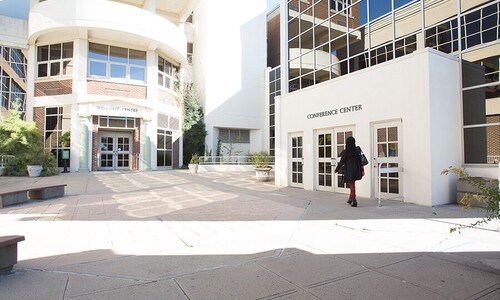 person walking to main entrance