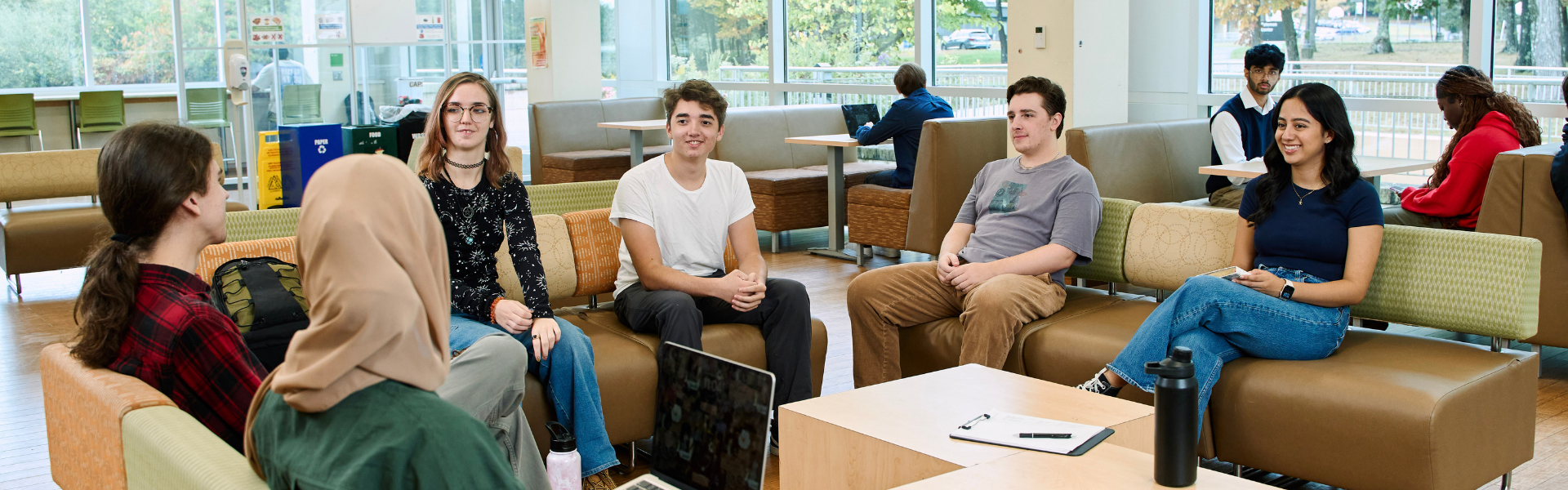 RVCC students sit and talk at the student center, upper floor.