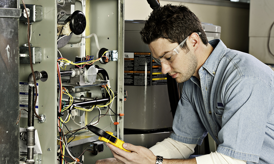 Service technician testing a furnace