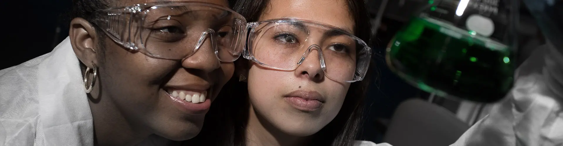 Image of students in protective glasses.