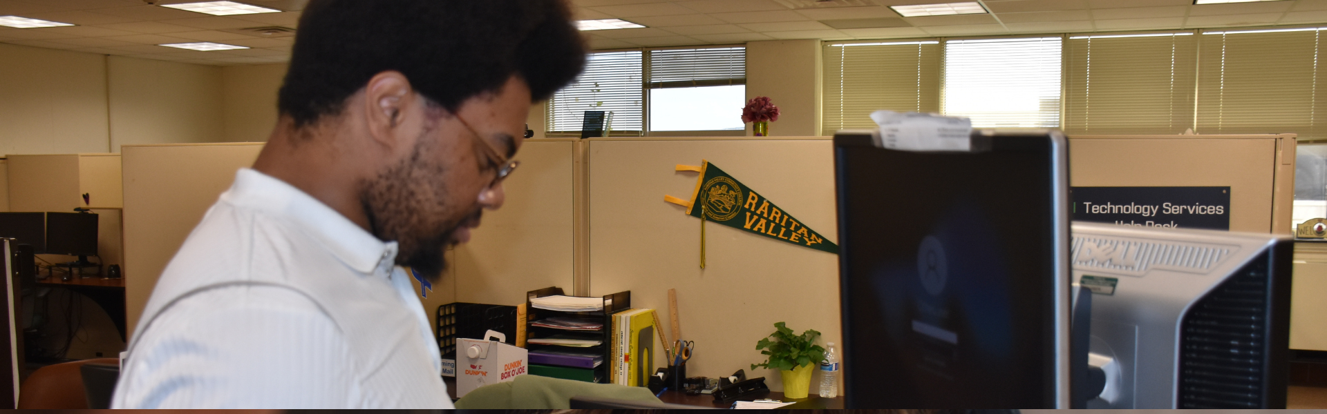 Image of a student utilizing the tech support department's resources