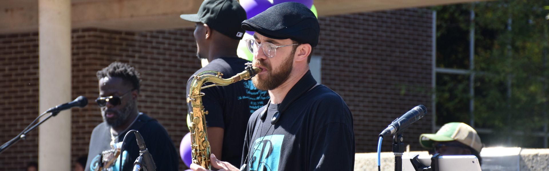 Image of a band playing saxophone in the RVCC quad.