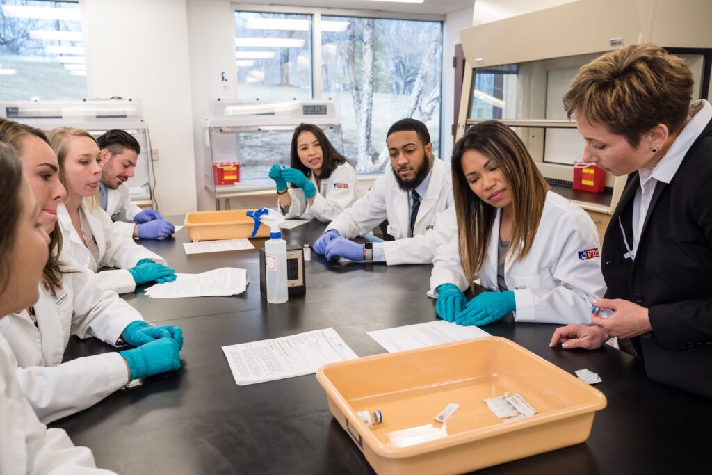 Dr. Anastasia Rivkin, Dean, FDU College of Pharmacy and Health Sciences, works with students in FDU’s Doctor of Pharmacy program