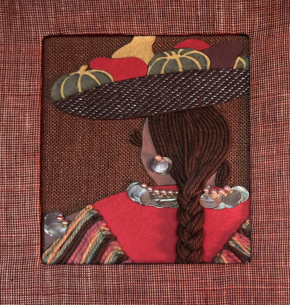 fabric art of back of woman wearing hat