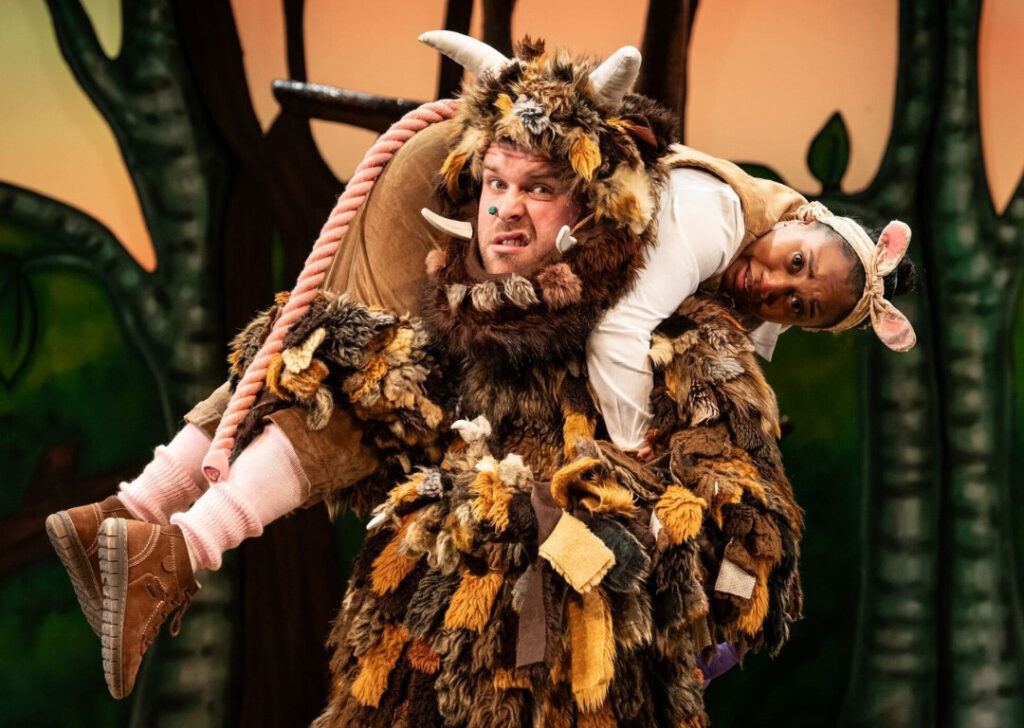 actor dressed as gruffalo carrying another actor